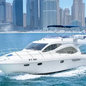 fishing trip Dubai. Majesty 44 ft cruising the waters of Dubai with the front view of the boat.