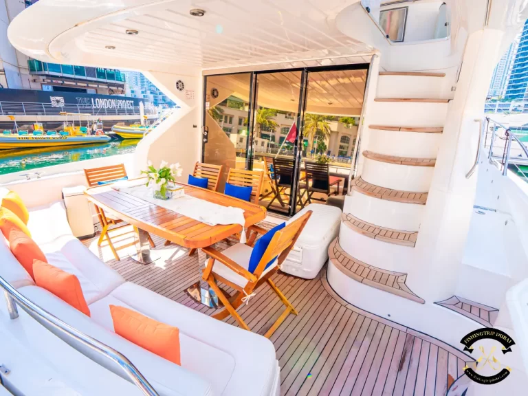 fishing trip Dubai. Sunseeker 70 ft exterior behind the boat.