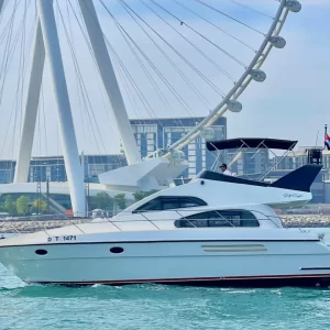 fishing trip Dubai. Majesty 48 FT side shot with Dubai eye in view.